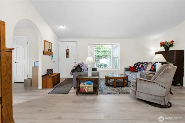 Here's another look at the cozy living room, beautifully finished with easy-care laminate flooring that adds warmth and charm to the space.