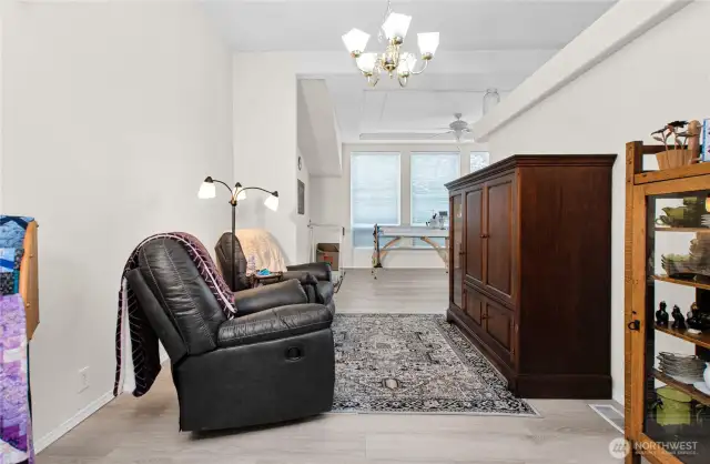 "This room is currently set up as a cozy TV space, but it’s a wonderful flex area—ideal for a large dining table, a home office, workout equipment, or whatever fits your lifestyle best."
