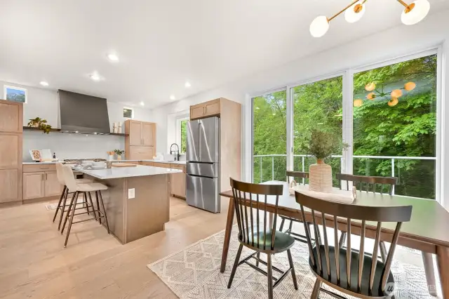 From the kitchen and dining room, step outside to nature on your large deck overlooking the backyard and greenbelt.