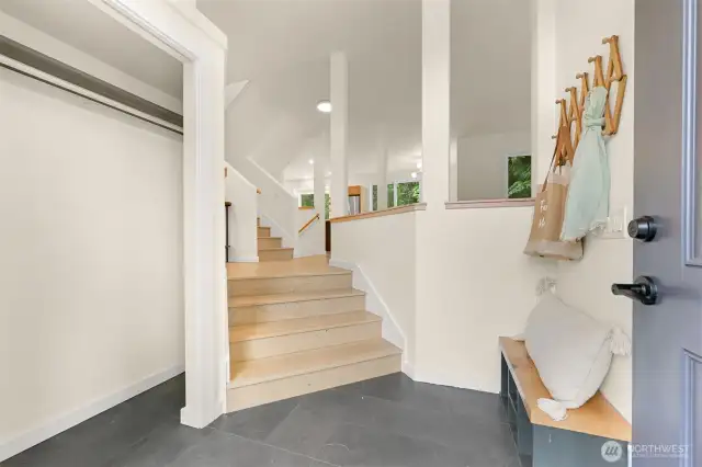 Private little landing as you enter with plenty of storage and a space to sit down to remove your shoes.