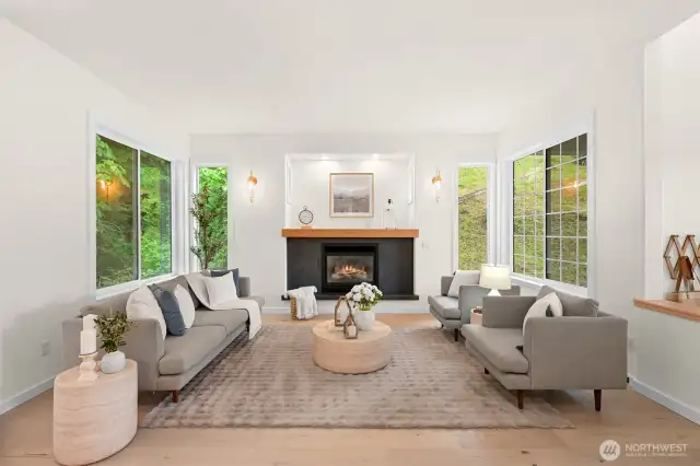 The living room remodel was just completed, and included new floors, fireplace, surround a custom mantel.