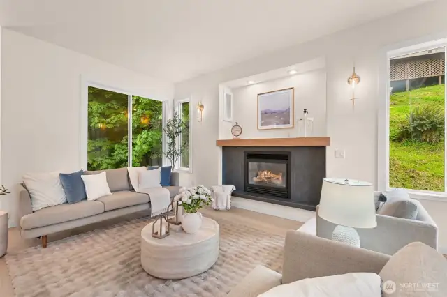 Windows in the living room look out to nature and create a serene environment even when inside.