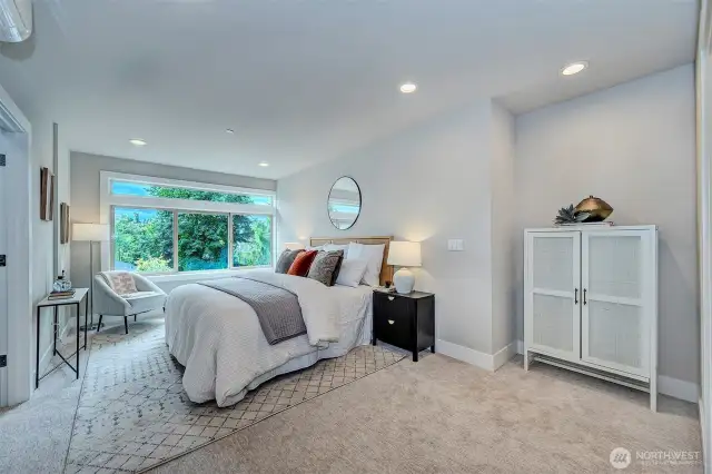 Elegant Primary ensuite with walk-in closet and tranquil views is sure to impress.
