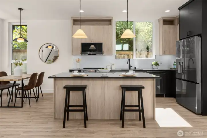 Kitchen with premium appliances + custom cabinetry.