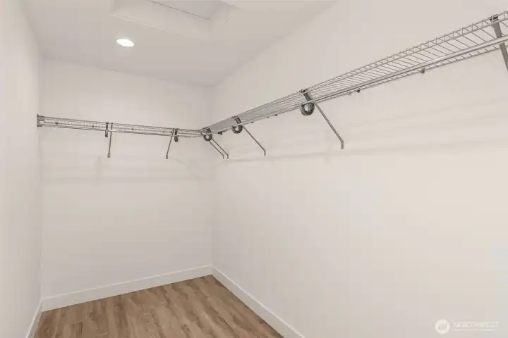 Walk-in closet with custom shelving.