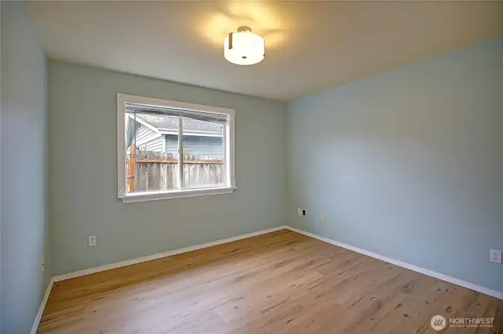 Cute guest bedroom features the new flooring!