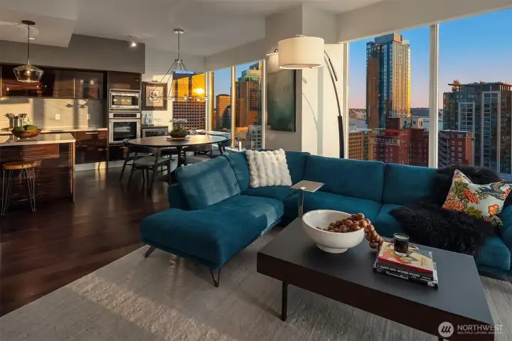 Soaring floor-to-ceiling windows showcase sweeping views of the Seattle skyline, Puget Sound, Elliott Bay, and the Olympic Mountains from 22 floors above the city.  The living and dining windows also have V-Kool 70% heat reduction film which reduces heat by 5-10 degrees in the summer!