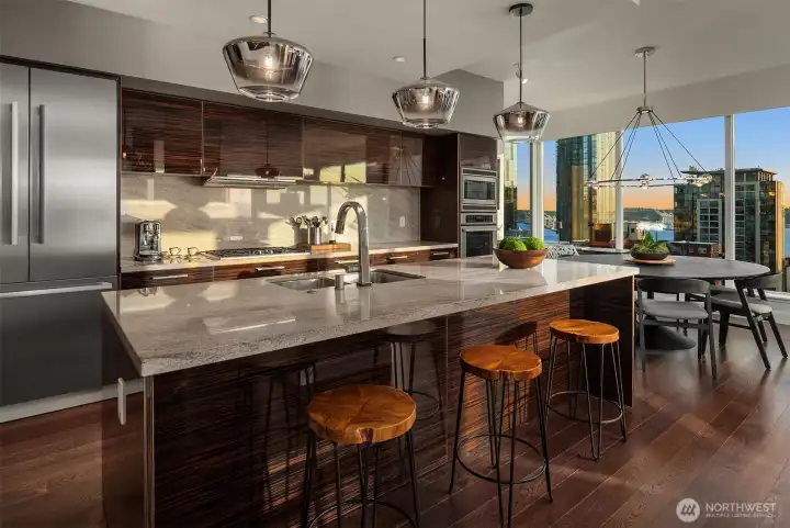 The gourmet kitchen is equipped with top-of-the-line appliances, ideal for culinary enthusiasts and entertainers alike.