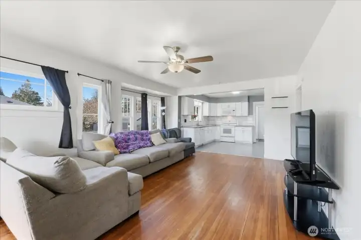 Expansive living room and space for a dining room table and chairs too.