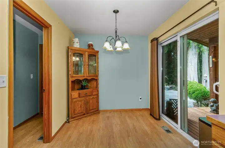Eating area in kitchen with access to outdoor deck and pond
