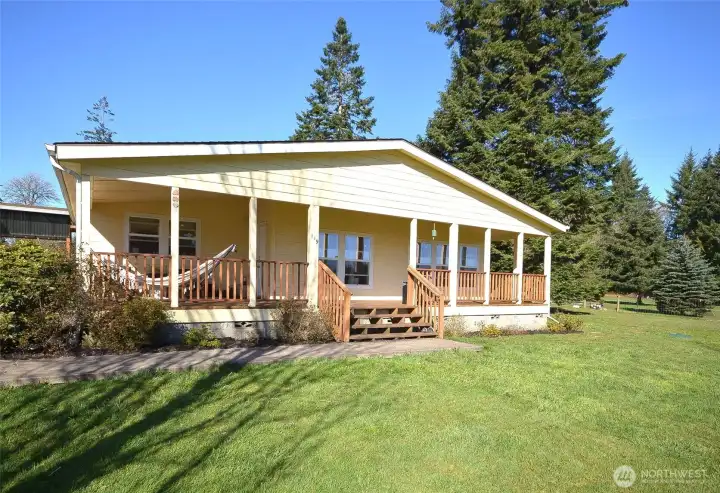 Situated on 2.5 level, fully fenced acres, this charming 3-bedroom, 1.5-bath home offers 2,050 sq ft of comfortable living space, a 2-car garage, hookups for 2 RVs, a barn, and a chicken coop—perfect for hobby farming, animals, toys, and outdoor living.