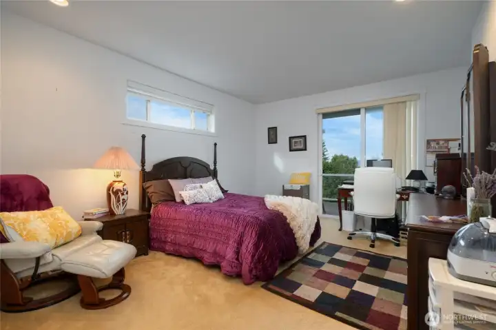 Spacious Main Floor Primary Bedroom with Sliding Door to Deck