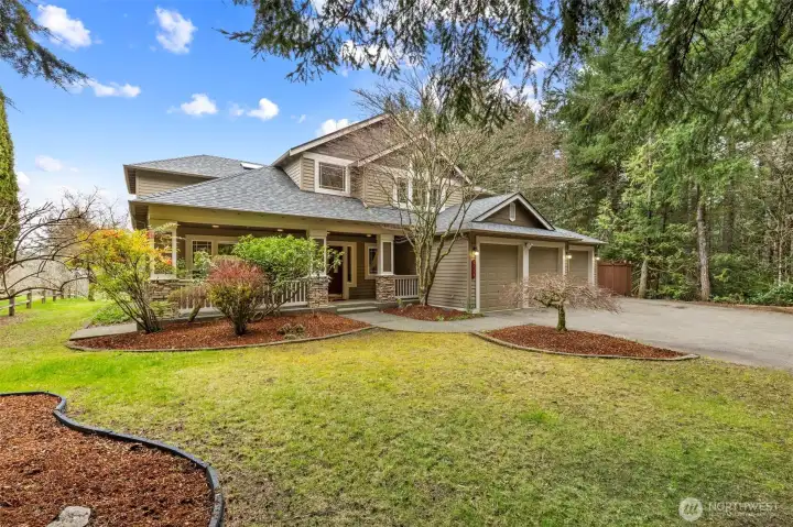 Spacious front yard w/mature trees & landscape.