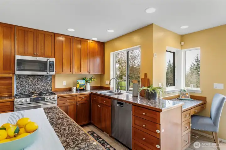 Open kitchen with island, solid granit counters & stainless-steel appliances!