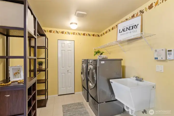 Large, oversized laundry/mud room flows to large. oversized 3-car garage!