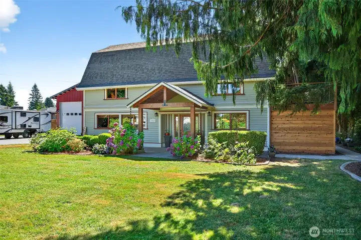 Set back with a large landscaped front yard and blacktop driveway with entry to the shop. Set back with a large landscaped front yard and blacktop driveway with entry to the shop.