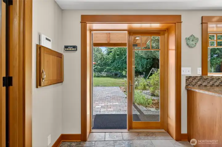 French doors lead to the spacious backyard with patio space, vegetable and flower garden, shaded dog run and large lawn. French doors lead to the spacious backyard with patio space, vegetable and flower garden, shaded dog run and large lawn.