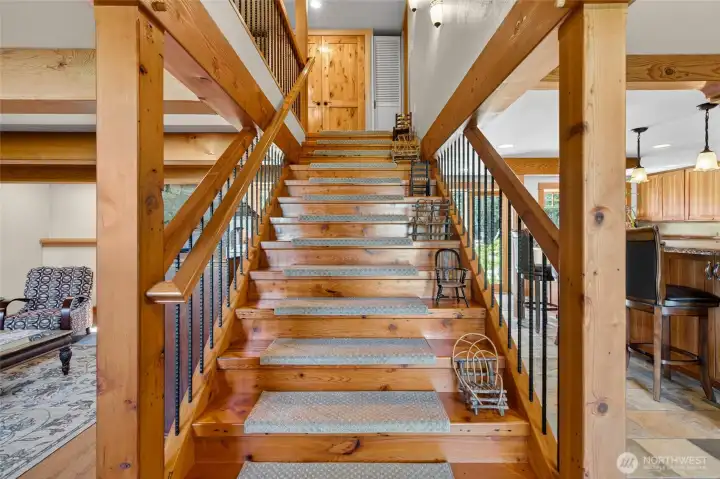 Entry way stairs invite you into this home with warm wood accents. Entry way stairs invite you into this home with warm wood accents.