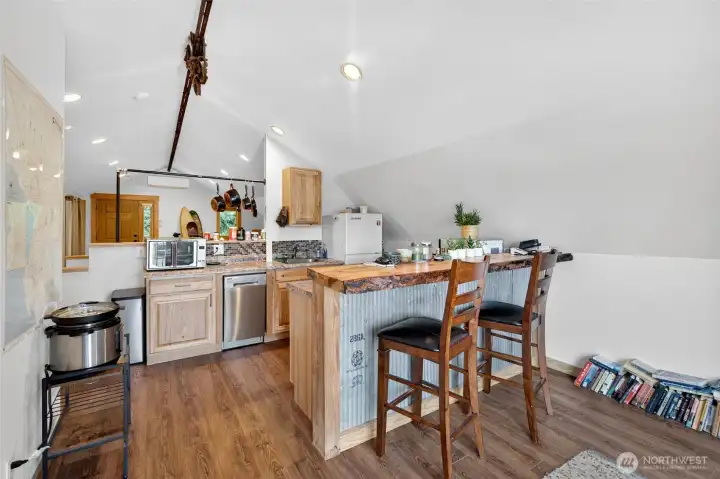 Kitchenette with 2 person bar. Kitchenette with 2 person bar.