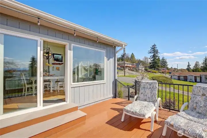 Convenient deck off the dining and kitchen area, offering effortless indoor-outdoor flow for entertaining and relaxing.