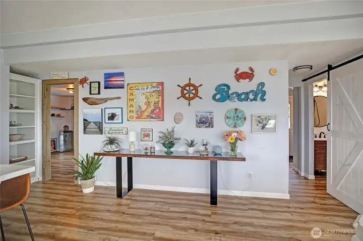 Functional layout with access to two bedrooms, full bath, and entry/utility room.