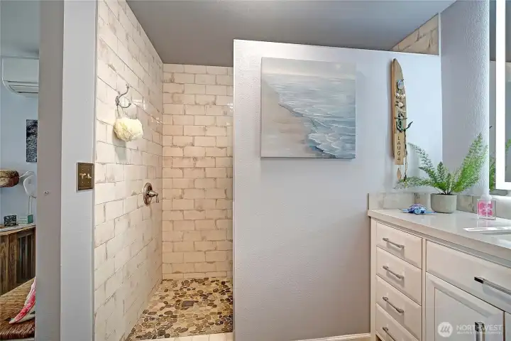 Primary bathroom with walk-in shower.