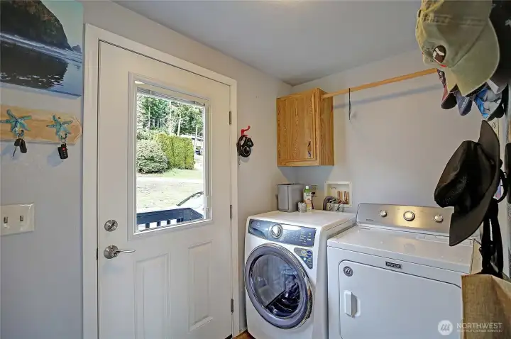 Front door leading into laundry/utility room.