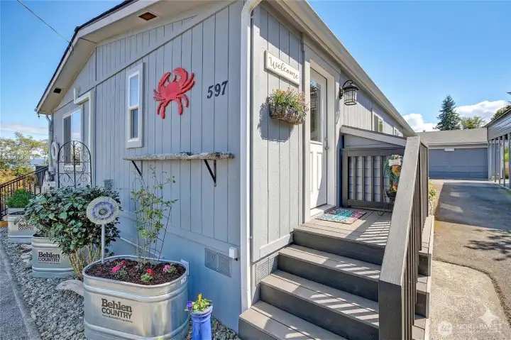 Front door leading into utility/laundry room.