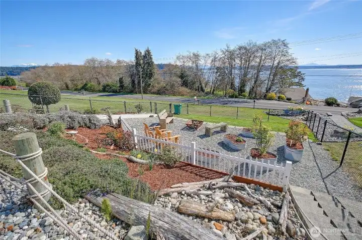 Enjoy the beautifully landscaped yard set against stunning water views.