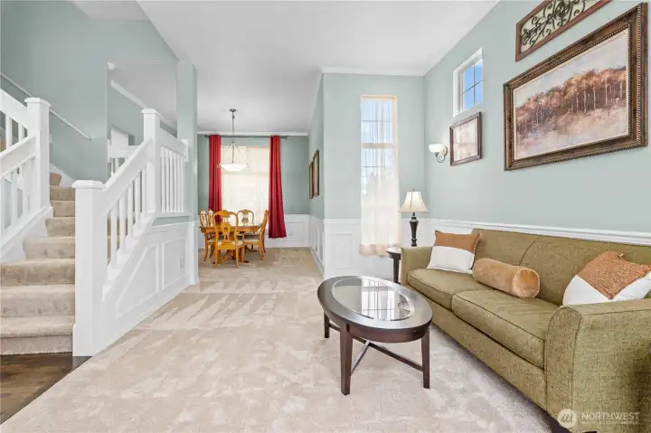 Living room to dining room features wainscotting