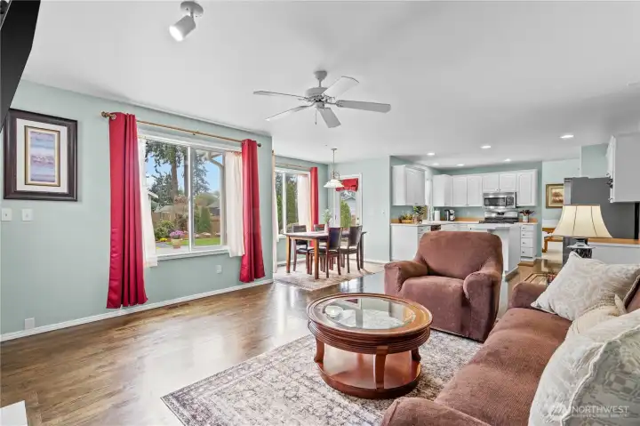 Large windows help the light flow in and the view of your gorgeous yard is featured