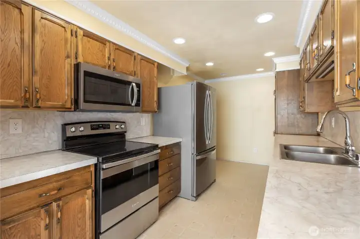 Garage entrance is on on the other side of the refrigerator.