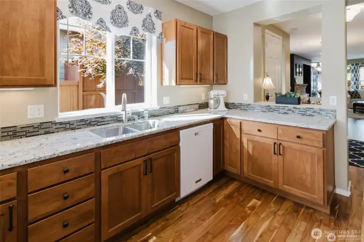 Lots of cabinets and counter space in this very functional kitchen
