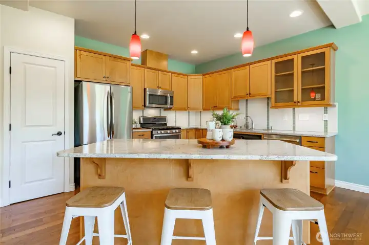 Center island with seating, pantry door Center island with seating, pantry door