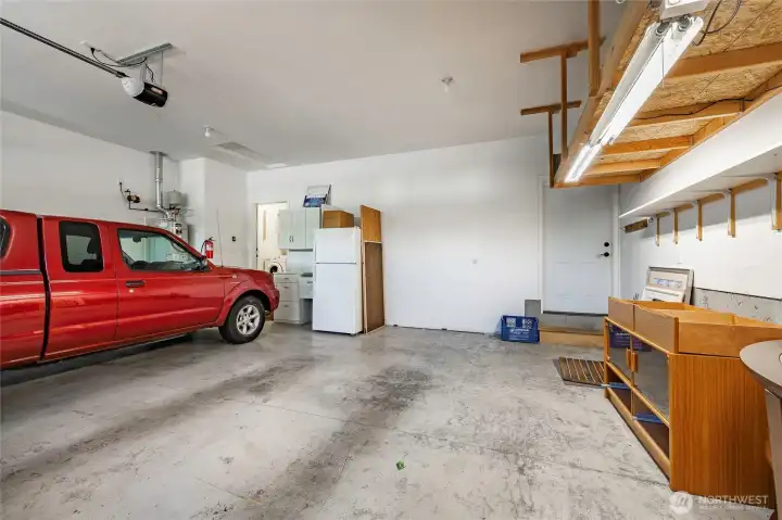 Good size 2 car attached garage with extra shop space and mandoor to the back yard. Good size 2 car attached garage with extra shop space and mandoor to the back yard.