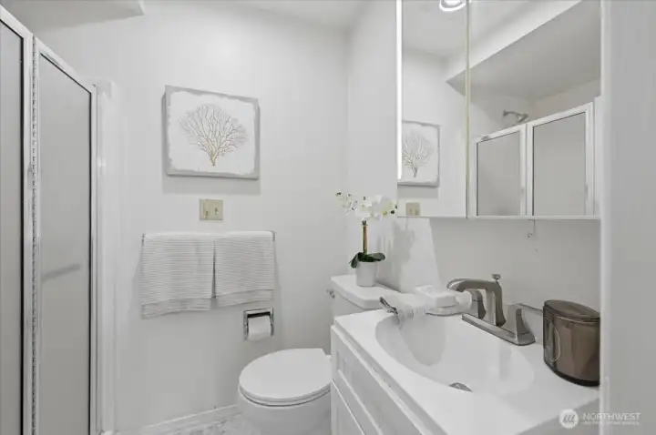 Three quarter bathroom adjacent to primary bedroom. Three quarter bathroom adjacent to primary bedroom.