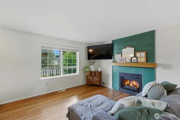 Gather around the cozy fireplace in your open plan layout
