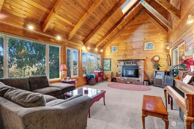 Family room with vaulted wood-paneled ceilings