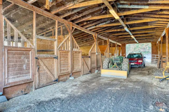 Large barn has six stalls built out, plus another side where six more stalls can be built in.