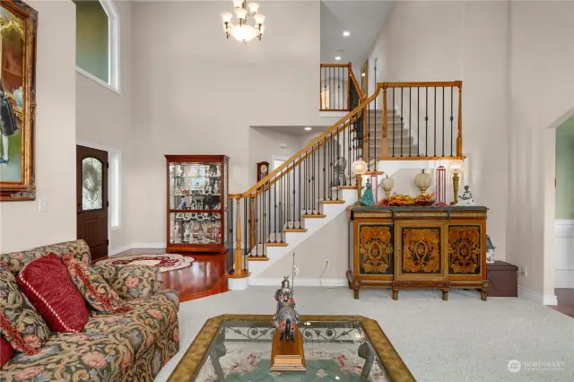 Living room looking towards entry and staircase.