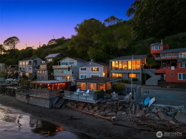 From the water at high tide, one can get a very good view of the private shoreline and wonderfully curated cabana and space around it.