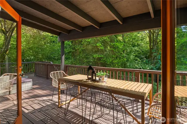 This portion of the deck is covered so you can enjoy nature and outdoor dining all year long.
