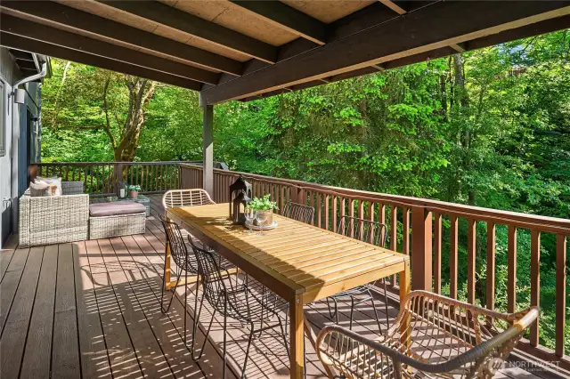 This enormous composite deck is low maintenance with half covered and the other half open.