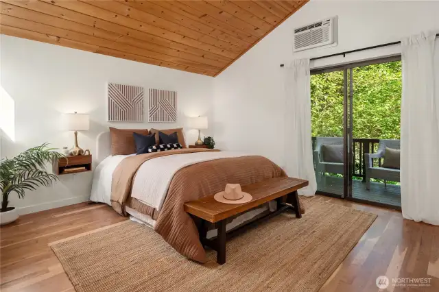 This enormous primary features a private deck, refinished hardwoods and a private bath.