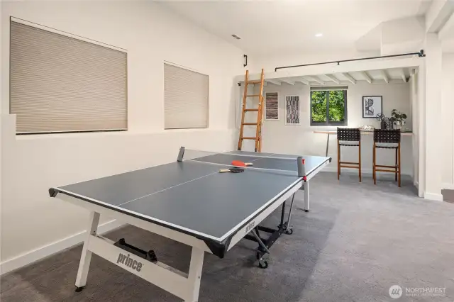 This enormous rec room is located on the lower level and boasts high ceilings and multiple lounge areas.