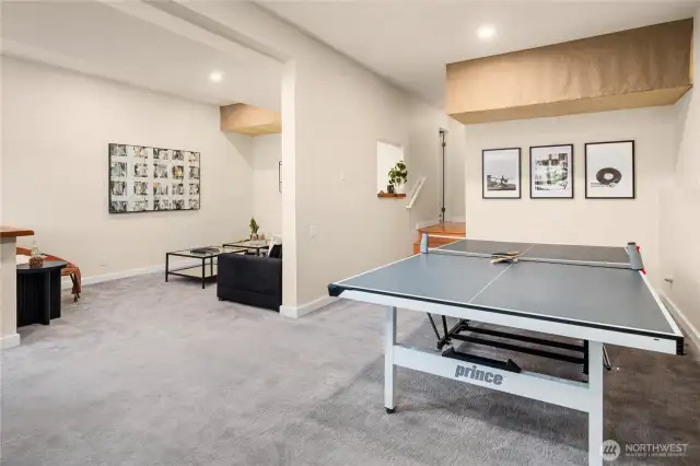 This shot of the rec room shows the enormity of both spaces with overhead storage (in addition to the massive storage room down the hall).