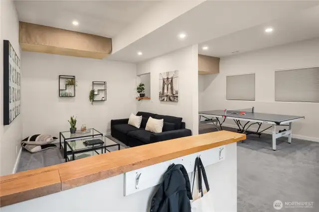 A tiled "mud room" is just off the lower entrance and open to the main rec room.