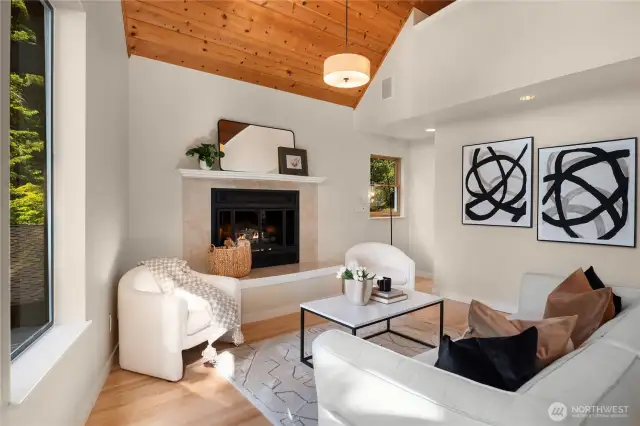 The soaring vaulted ceilings feature knotty pine and run all the way up to the upper floor and loft.