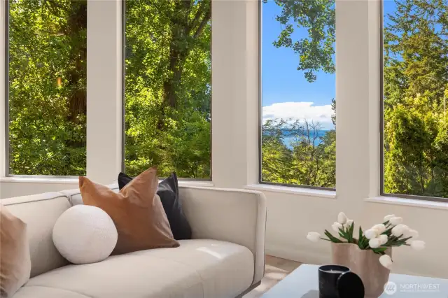 Pleasant sound and mountain views are prominent from the main floor living room.