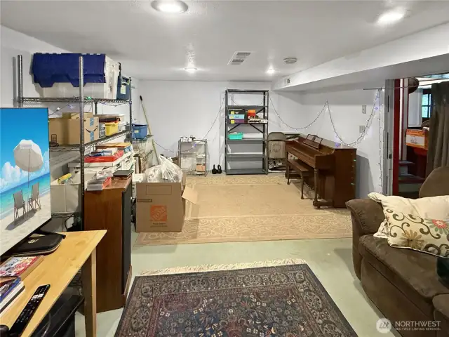 serious storage. With open shelving, durable floors, and plenty of ceiling height, it’s a practical extension of the home with tons of potential. Hobbyist? Collector? Organizer? This space says yes.